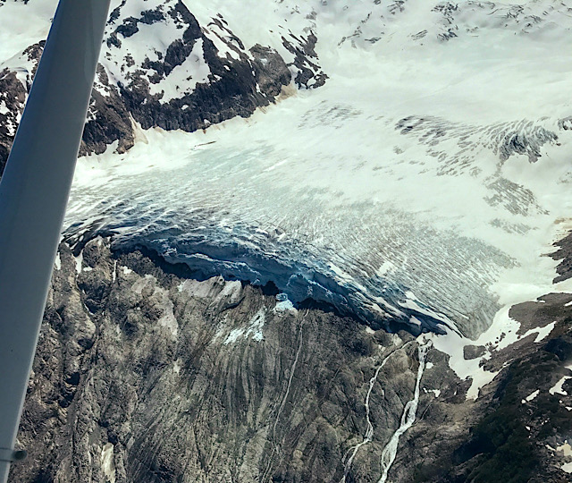 View looking down onto Hanging Glacier as it recedes up the cliff face