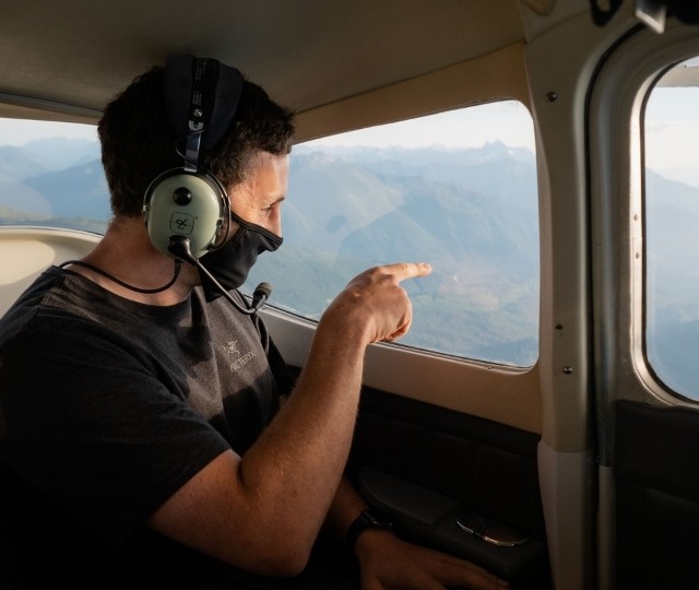Wearing a facemask while looking out of the window