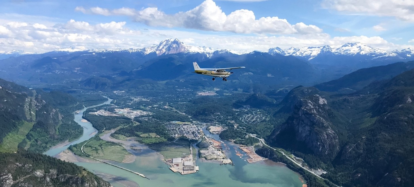 Sea To Sky Air plane flying over Squamish