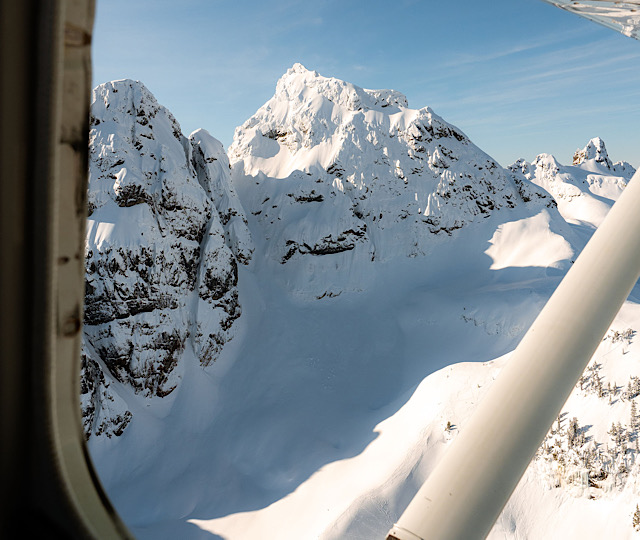 The peak of a nunatuk poking out if the glacial ice as viewed from a scenic flight with Sea To Sky Air