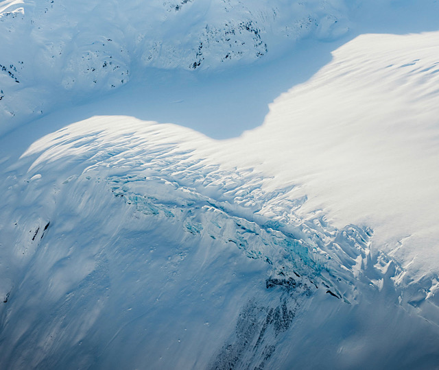 Hanging Glacier in the winter covered in snow shot from a guided scenic flight with Sea To Sky Air