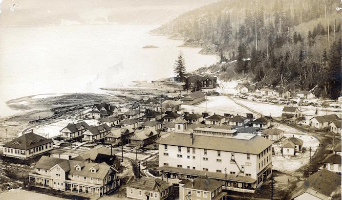 Sepia coloured photo of Britannia Beach buildings on the waterfront in the early 1900’s