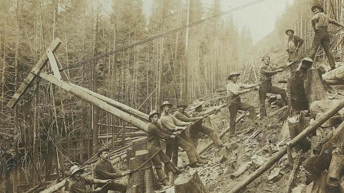 Sepia coloured photo men working in the forest to build Britannia Mine in the early 1900’s